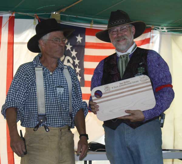 Doc McCoy being presented an engraved cheeseboard.